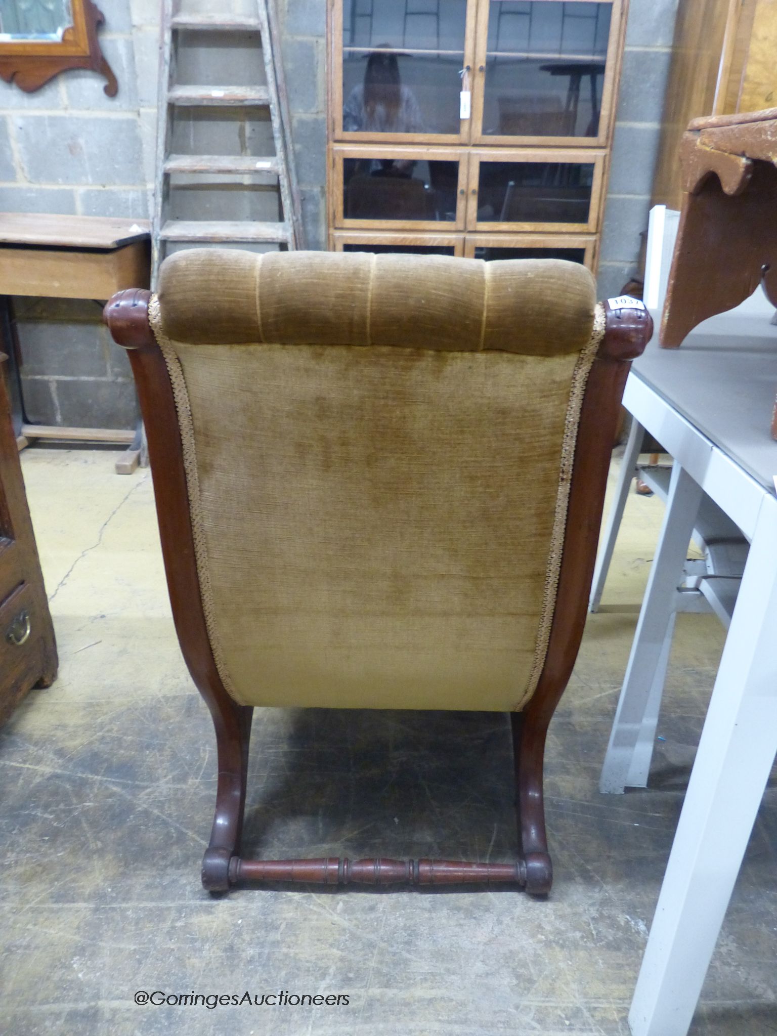 A Victorian mahogany slipper chair.